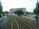 Basel: tramvajový svršek čerstvě po rekonstrukci a před zatravněním u zastávky Reinach BL, Landererstrasse na trati do Aesche, 24.6.2014 © Jan Přikryl