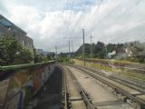 za zastávkou Münchenstein Neuewelt/Grün 80 se tramvajová trať do Dornachu přimyká k trati Jurabahn, 24.6.2014 © Jan Přikryl