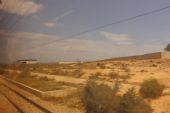 09.06.2016 - úsek Sousse Zone Industrielle - Sousse Sud: už kompletně obezděné depo Banlieue du Sahel na dohled (foto z vlaku) © PhDr. Zbyněk Zlinský