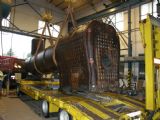 27.08.2011 - Kolín: kotel stroje 411.019 ''''Conrad Vorlauf'''' dorazil do haly SEA CZ, a.s. © SŽVJ